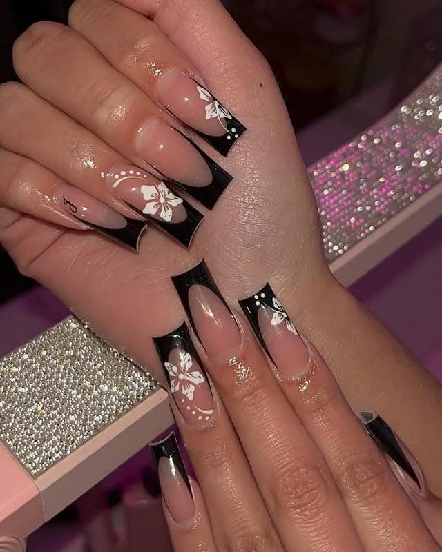 6. Black French Tip Nails with White Floral Art - classy black nail ideas