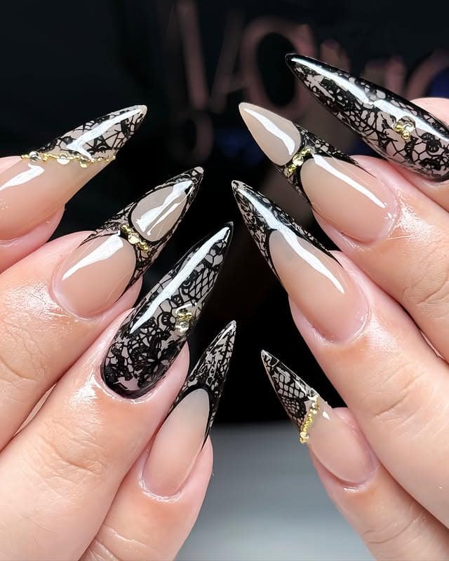 9. Black Lace Stiletto Nails with Gold Studs - classy black nail ideas