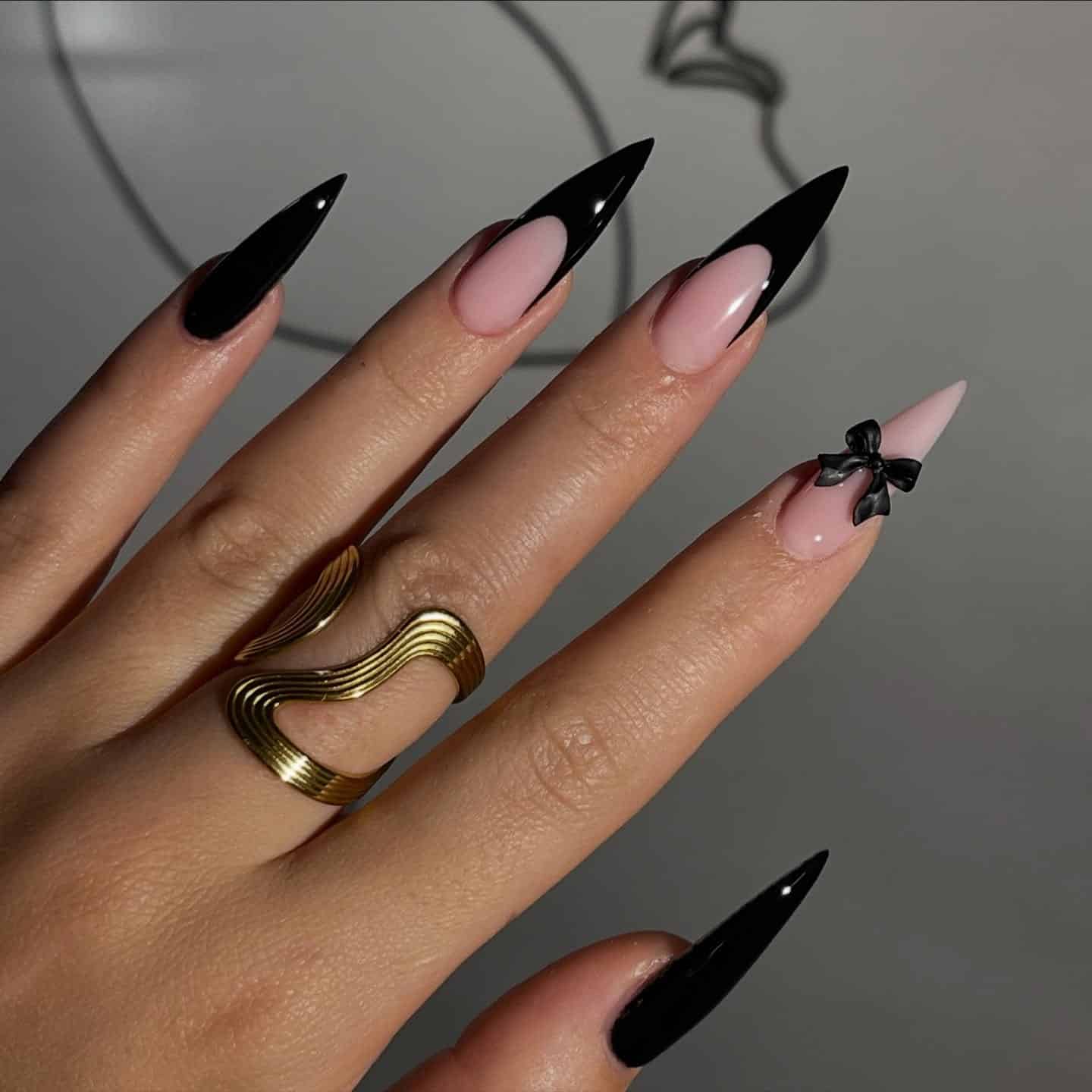13. Black French Stiletto Nails with Bow Accent - classy black nail ideas
