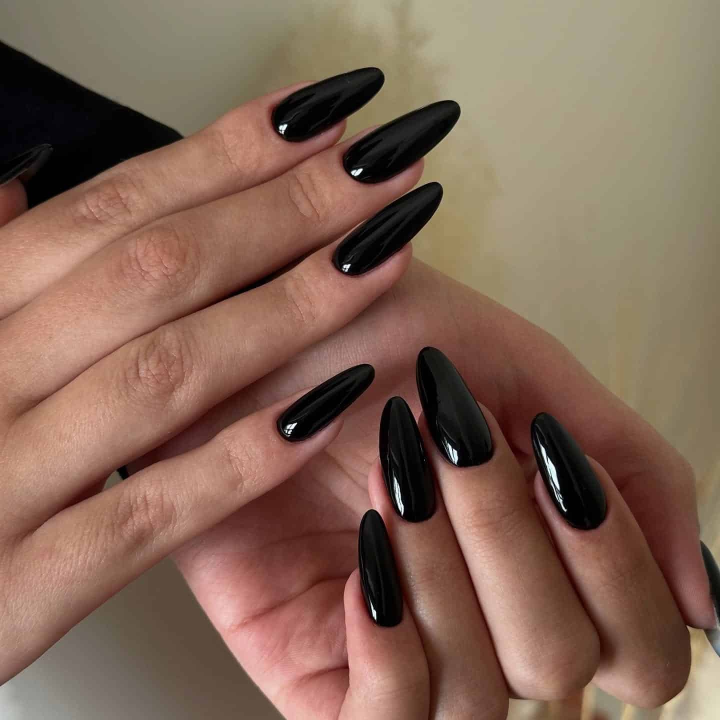 19. Glossy Black Almond Nails - classy black nail ideas