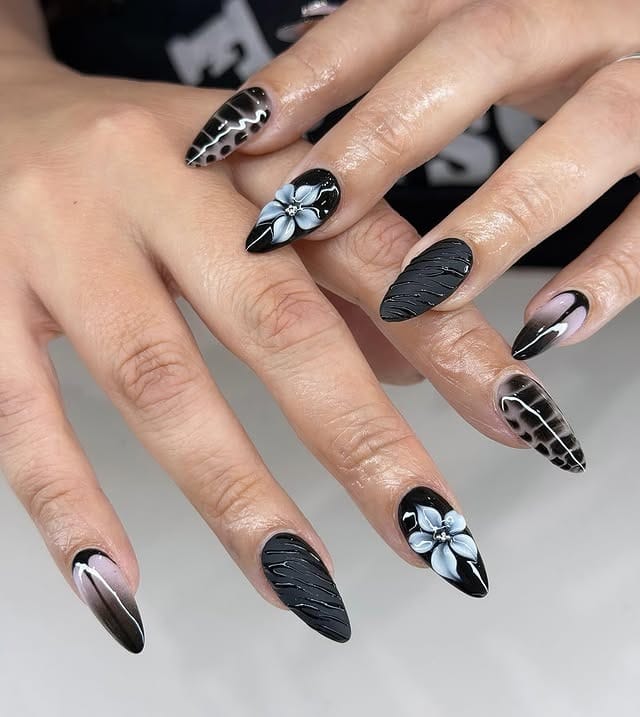 22. Black Floral and Textured Stiletto Nails - classy black nail ideas