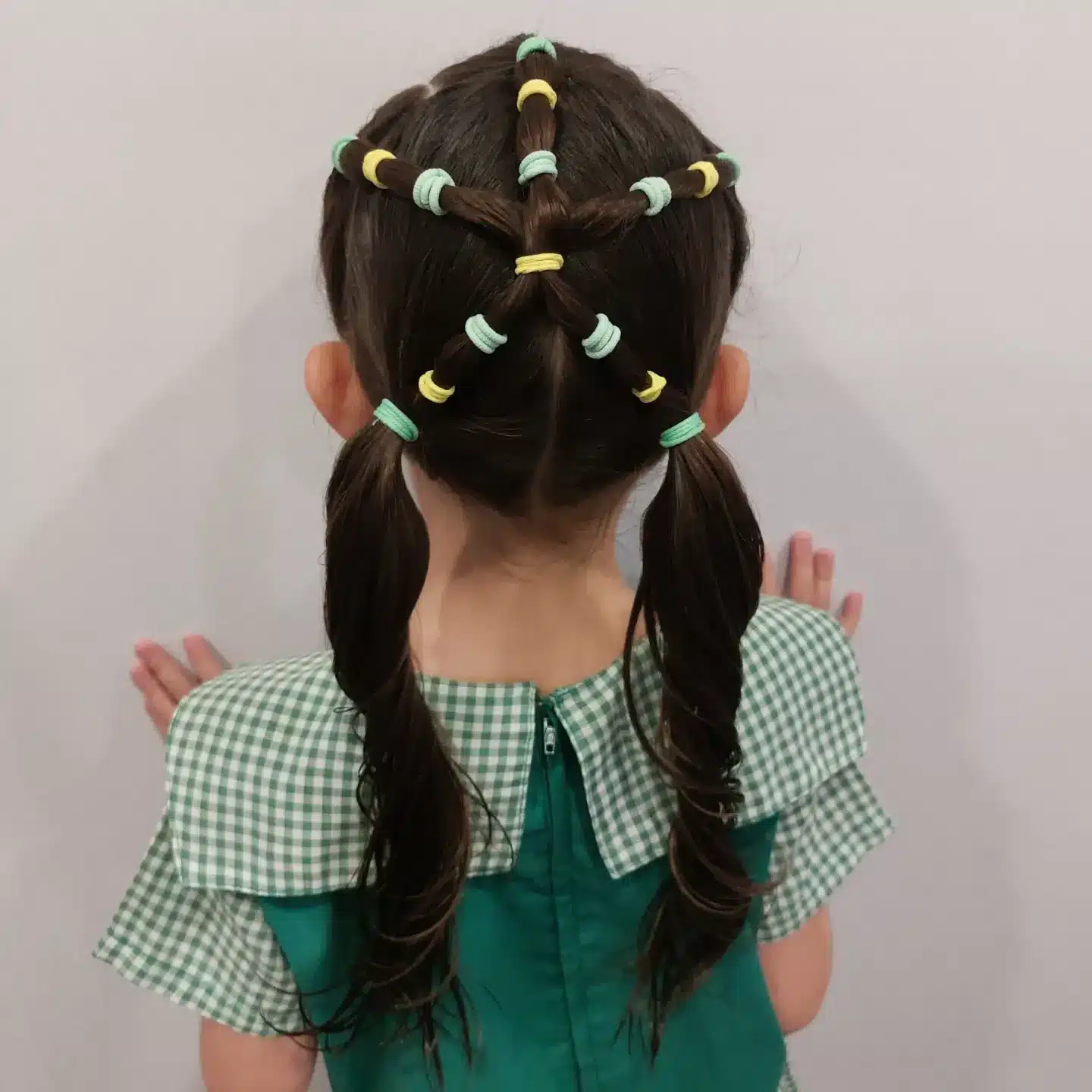 8. Star Elastic Pigtails with Dark Brown Hair - Hairstyles For School