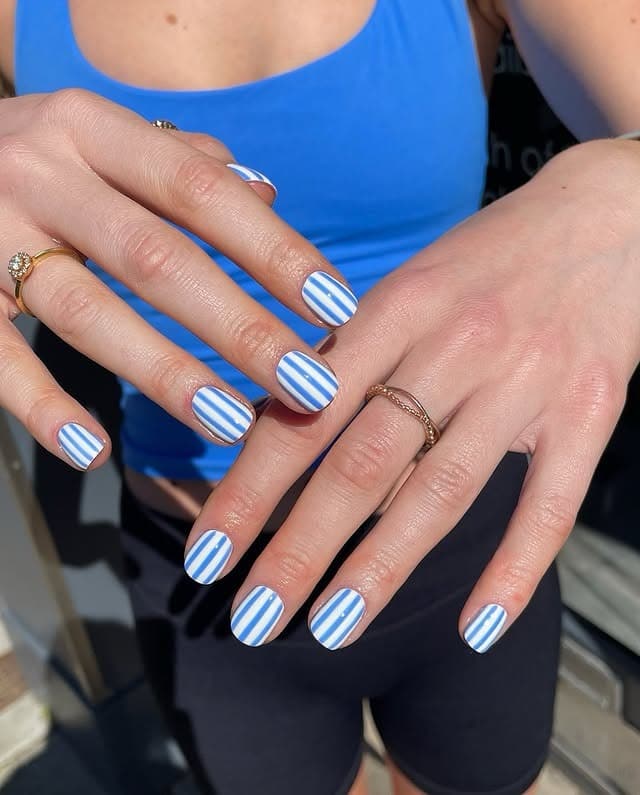 4. Sky Blue Striped Short Nails - cute and easy nail ideas