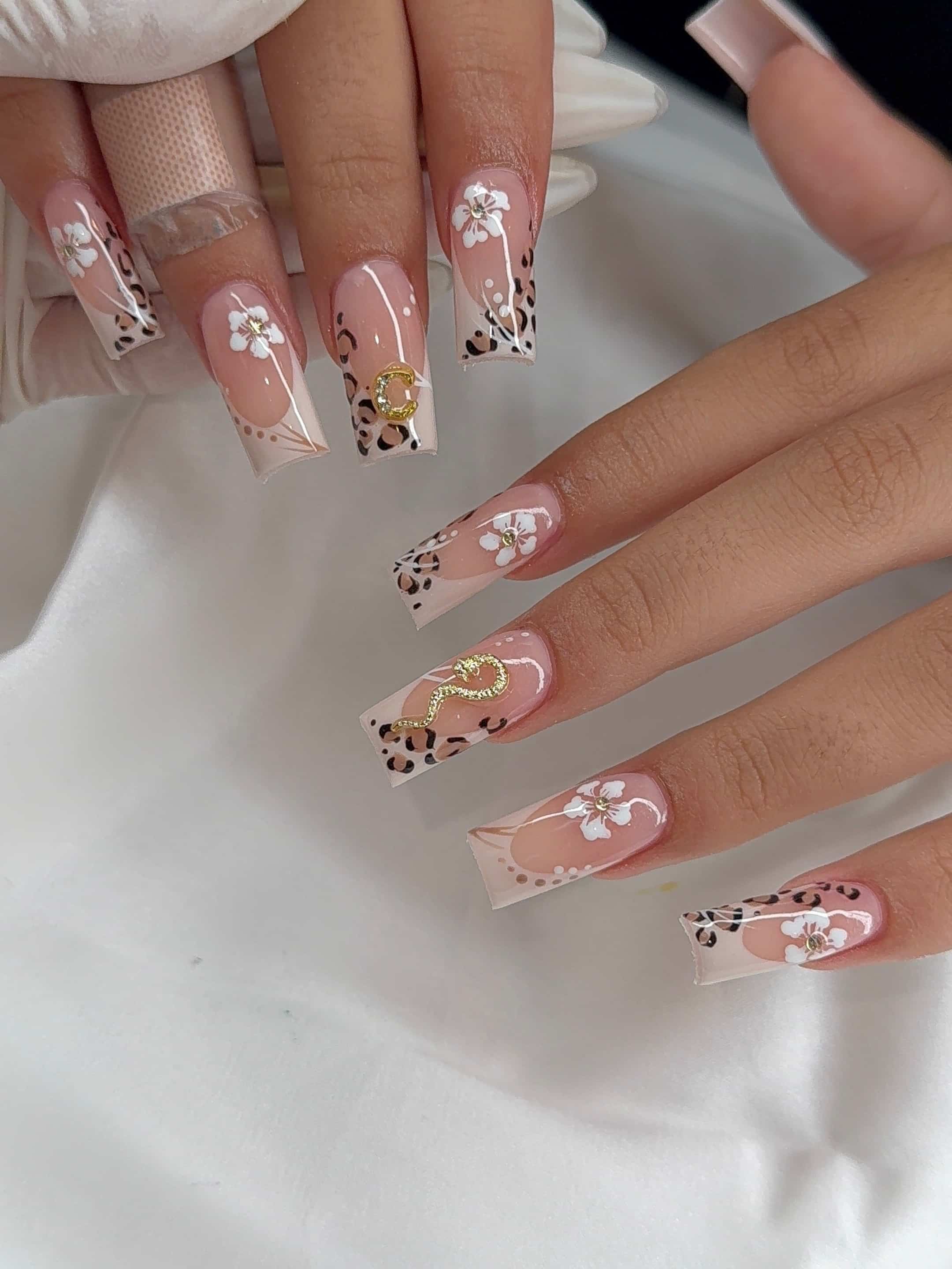 8. Nude Floral Square Nails with Leopard Accents - cute and easy nail ideas