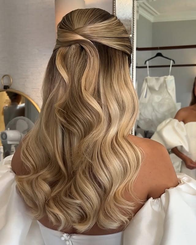 4. Sleek Champagne Blonde Twisted Half-Up Waves - Wedding Hairstyles