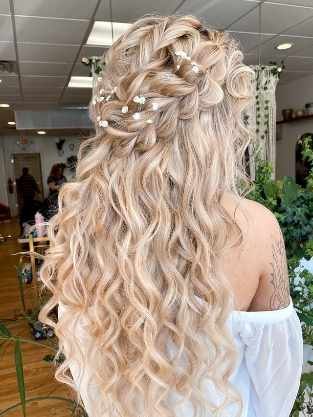 9. Voluminous Platinum Blonde Curly Half-Up Style - Wedding Hairstyles