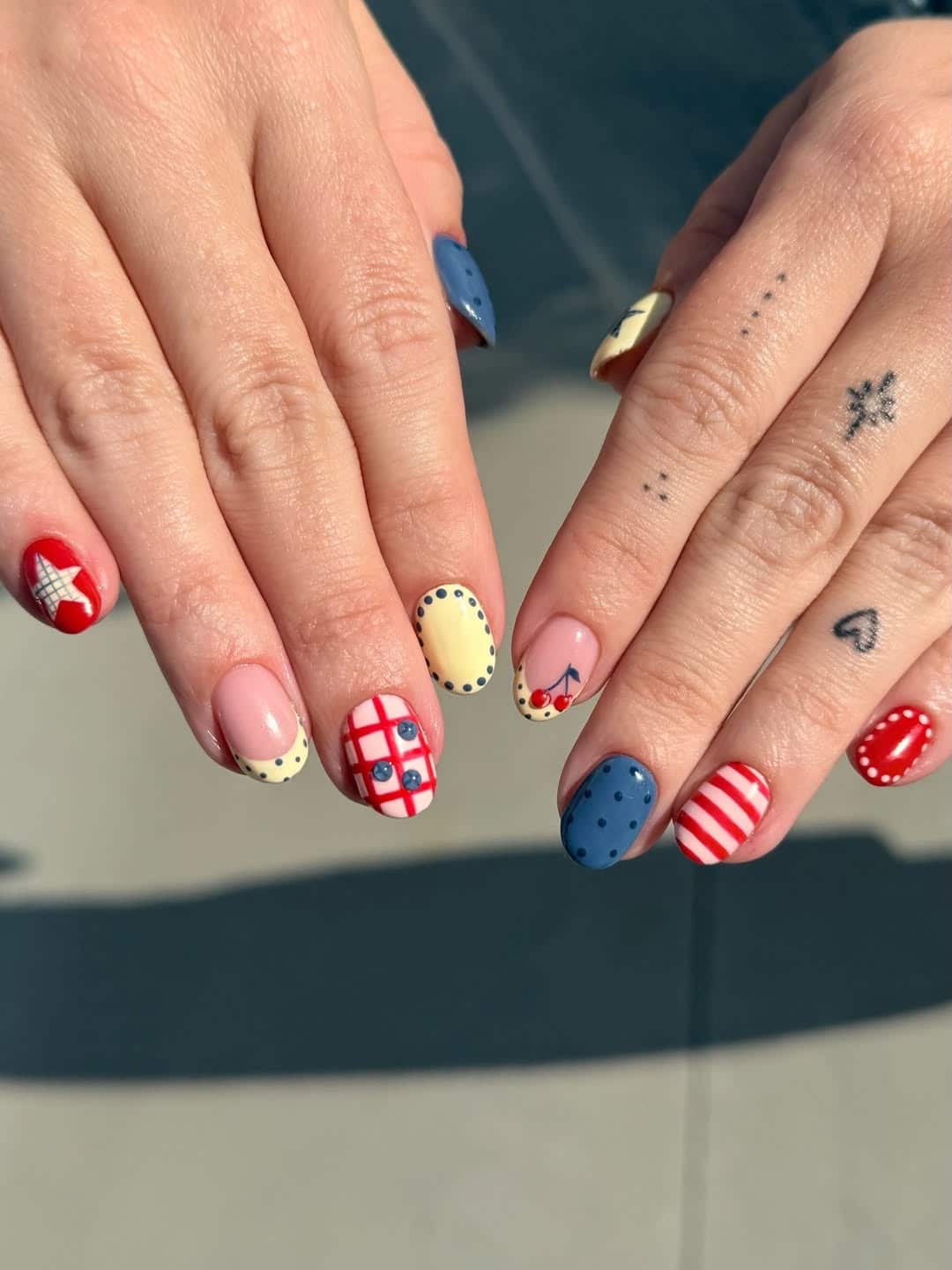 16. Red Blue Cherry Short Round Nails - cute simple nail ideas