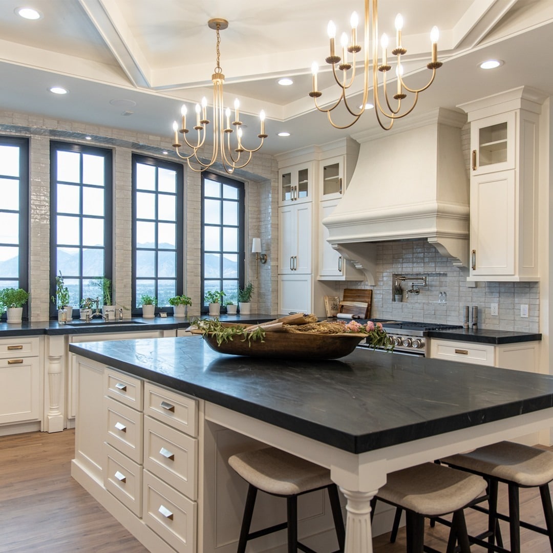 7. White Kitchen Ideas with Black Countertops and Brass Lighting - timeless kitchen ideas