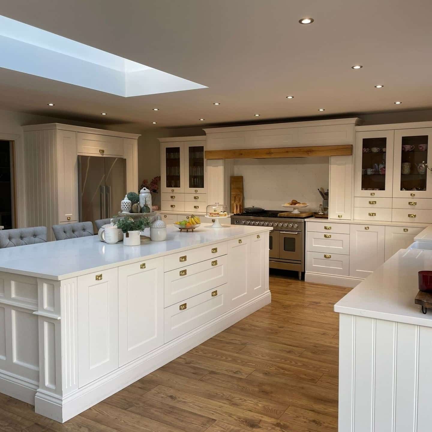 15. White Timeless Kitchen Ideas with Warm Wood Flooring - timeless kitchen ideas