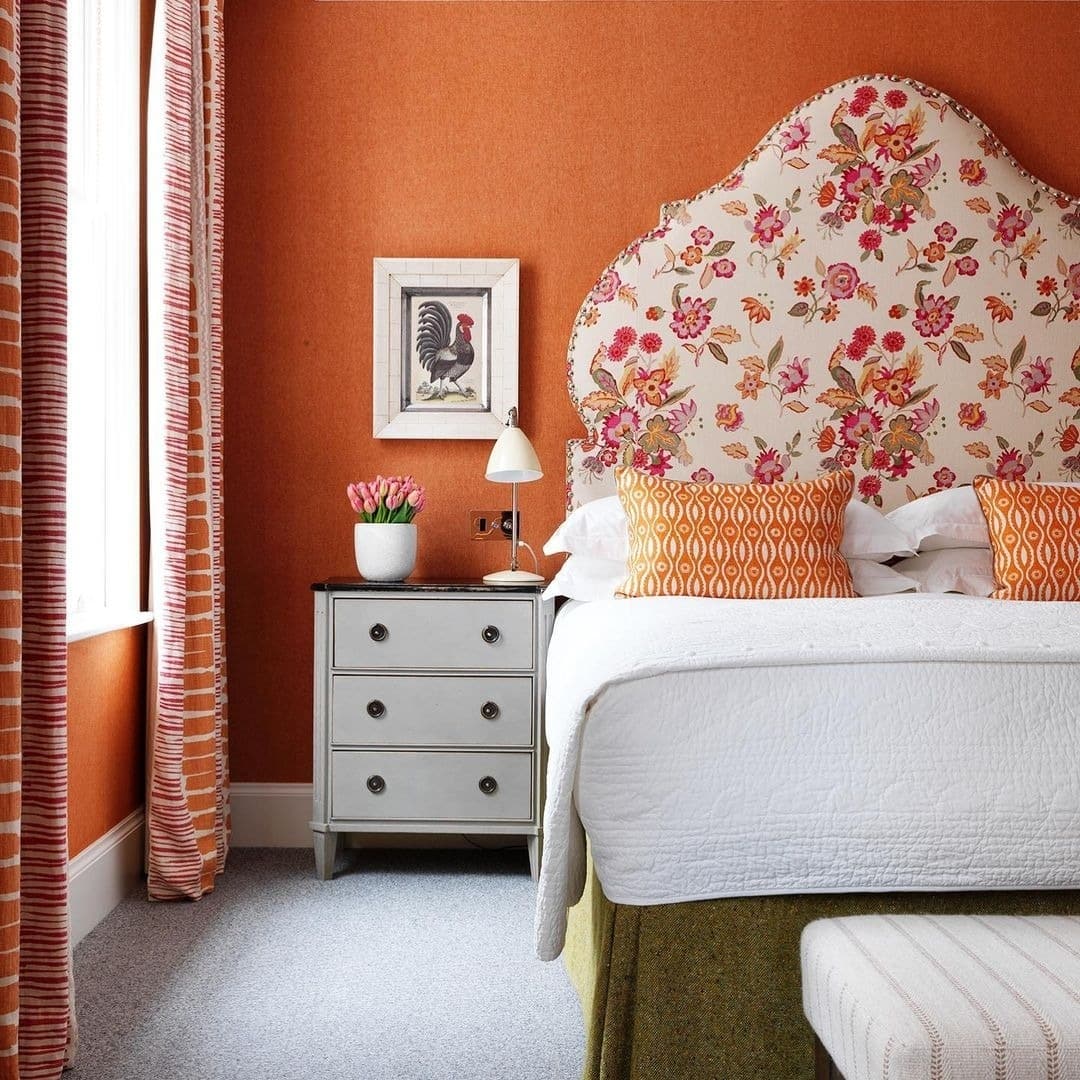 20. Elegant Burnt Orange Bedroom Ideas with Floral Headboard - orange bedroom ideas