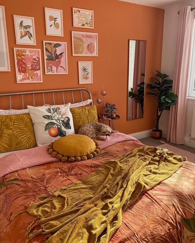 22. Modern Orange Bedroom Ideas with Botanical Wall Art - orange bedroom ideas