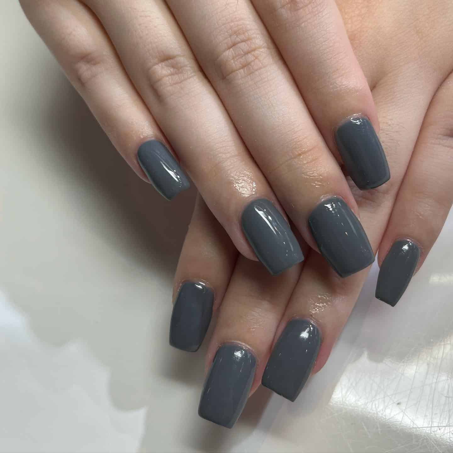 2. Solid Charcoal Gray Coffin Nails - gray nail ideas