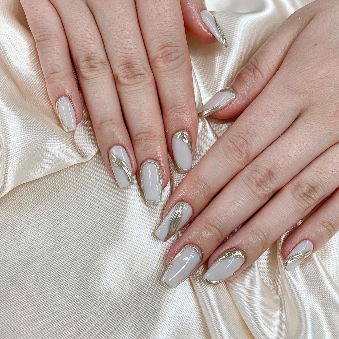 7. Gray Nails with Metallic Chrome Swirls - gray nail ideas