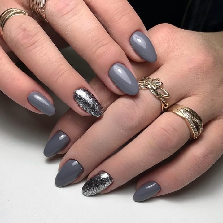 16. Gray Almond Nails with Silver Glitter Accent - gray nail ideas