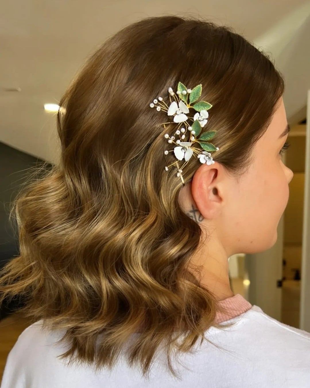 5. Soft Brown Wavy Bob with Floral Hair Clip - Short Wavy Hairstyles