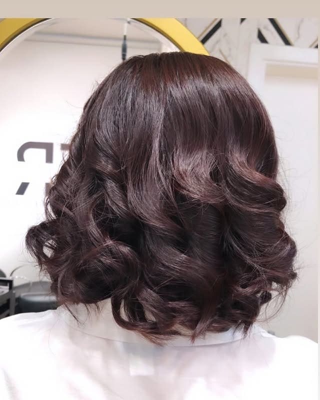 15. Dark Chocolate Curled Bob - Short Wavy Hairstyles