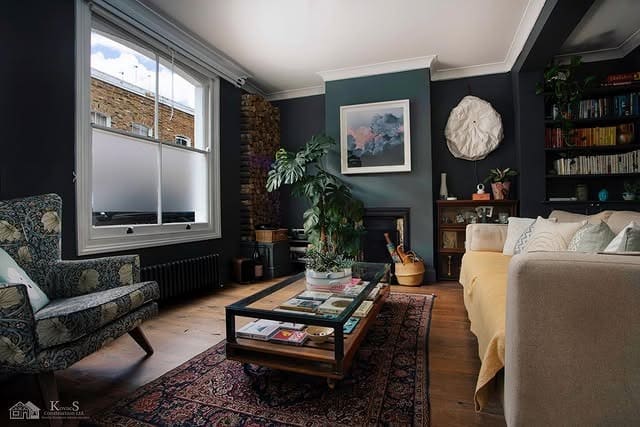 4. Cozy Dark Living Room Ideas with Charcoal Blue Walls - dark living room ideas