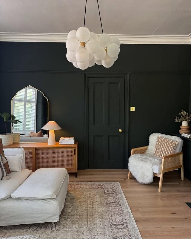 13. Cozy Dark Living Room Ideas with Black Walls and Light Wood - dark living room ideas