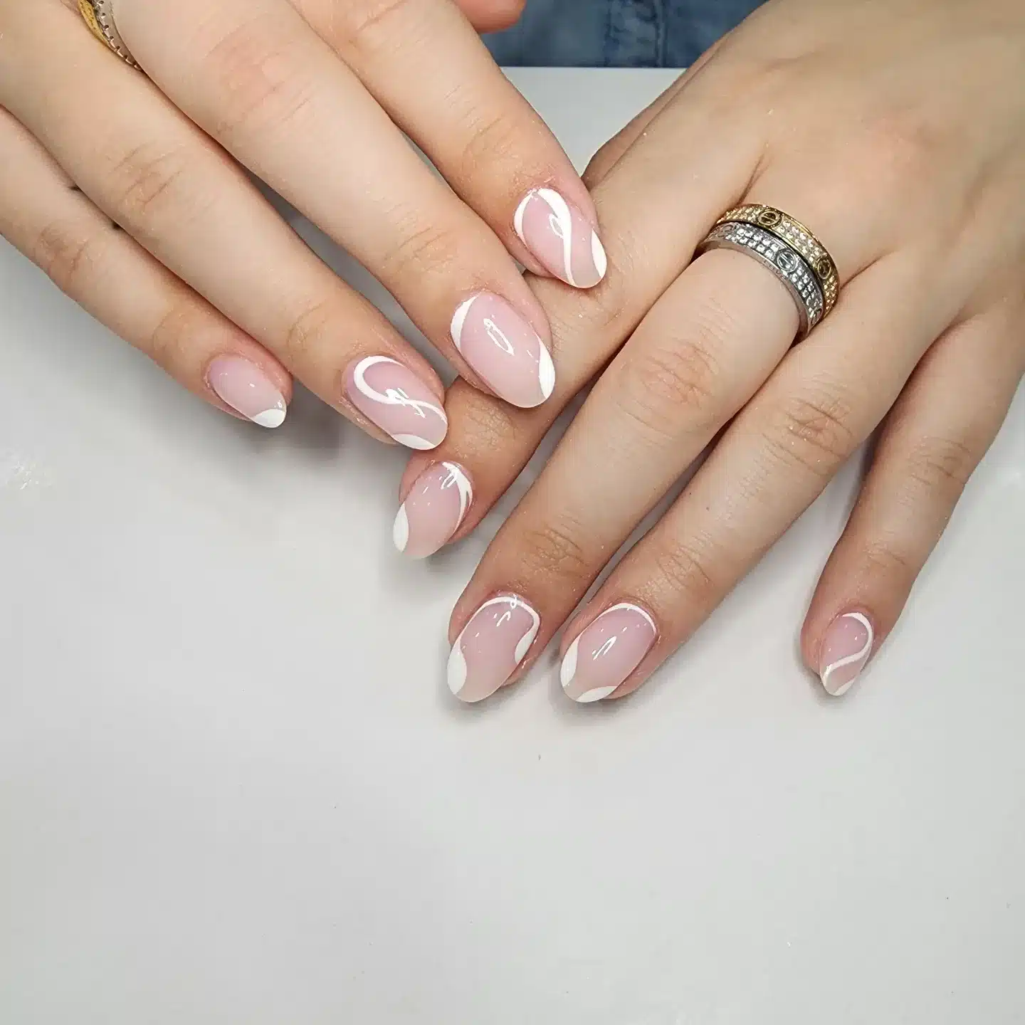 13. White Swirl French Line Almond Nails - line nail ideas