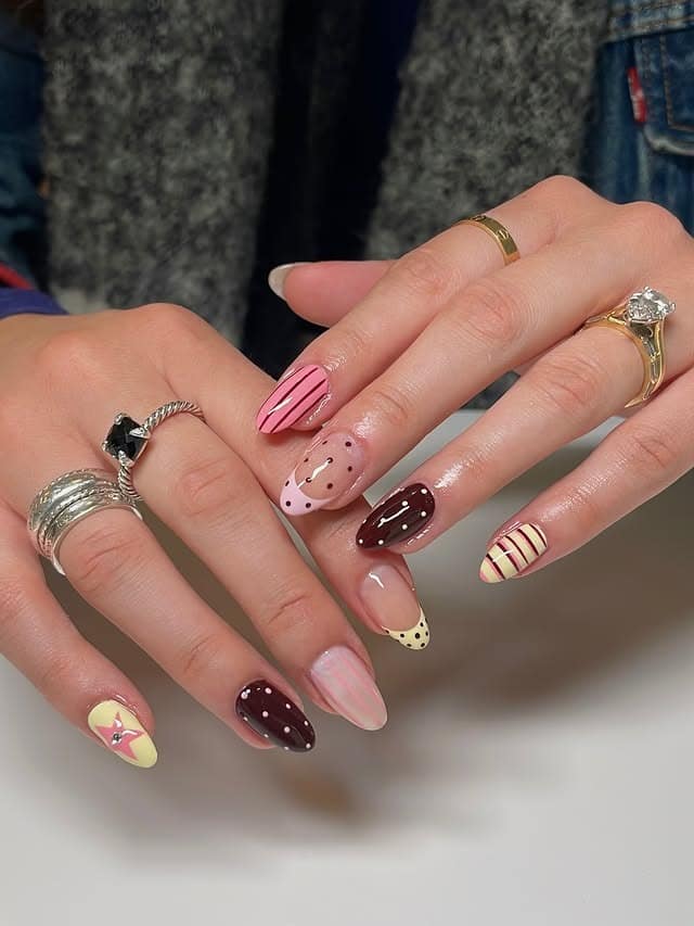 21. Mixed Pattern Pastel Line Almond Nails - line nail ideas