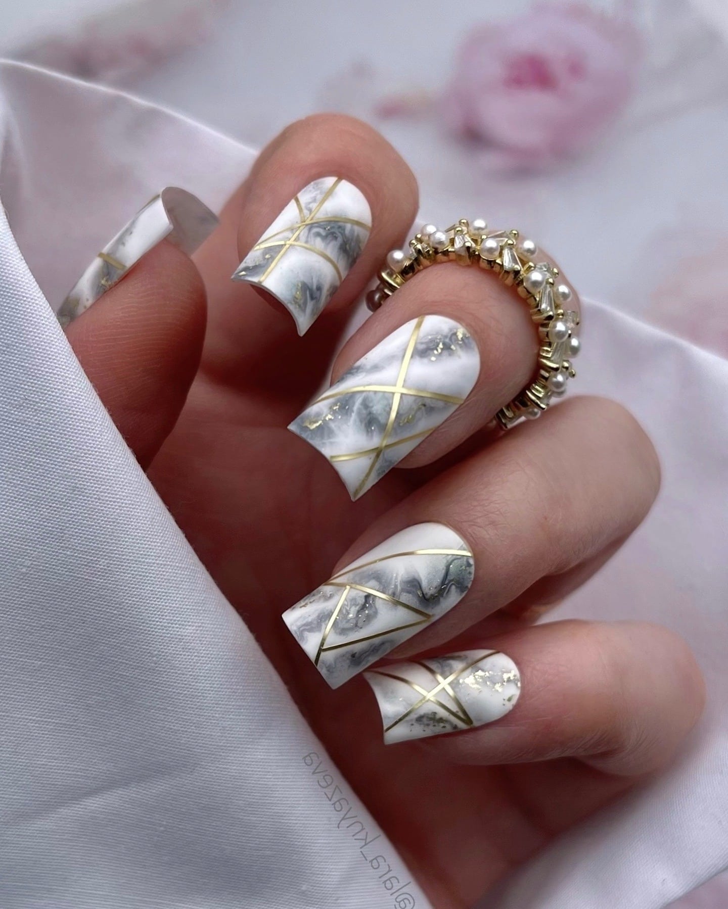 2. White Marble Square Nails with Gold Lines - marble nail ideas
