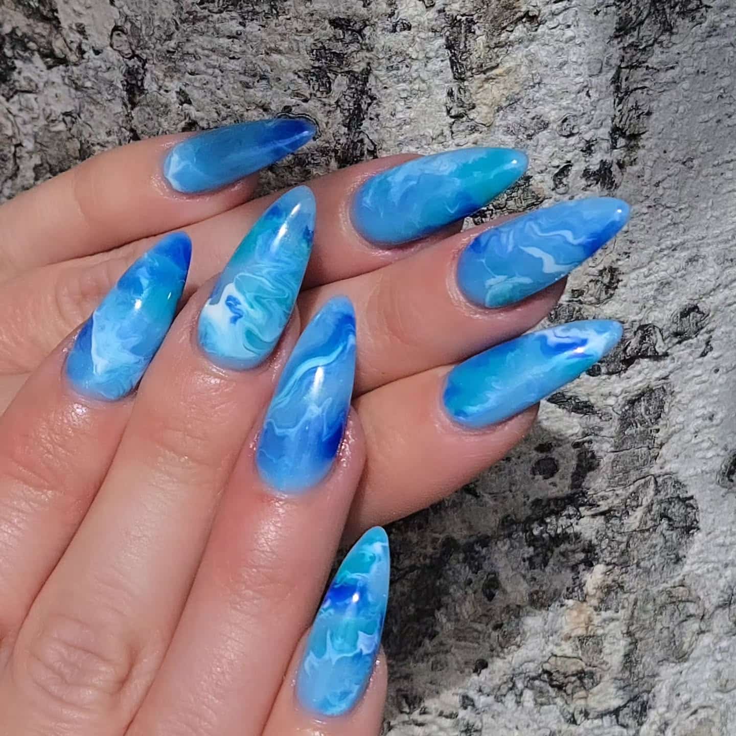 3. Ocean Blue Almond Marble Nails - marble nail ideas