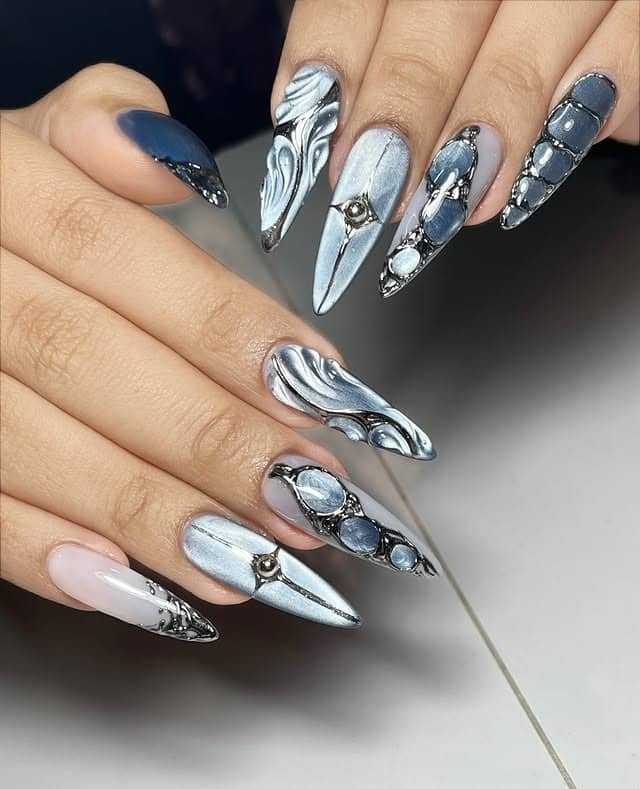 5. Silver Chrome Stiletto Marble Nails - marble nail ideas