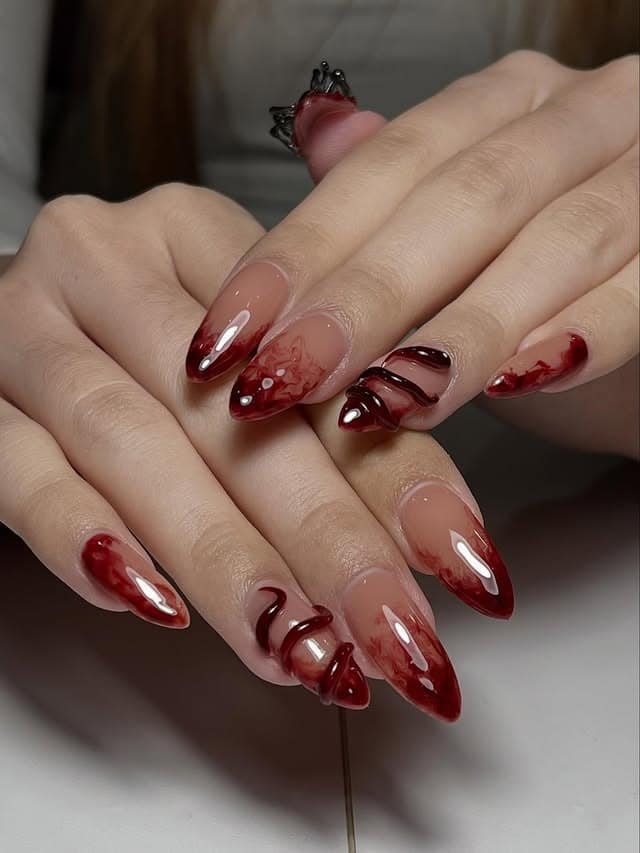 6. Burgundy Marble Aura Almond Nails - marble nail ideas