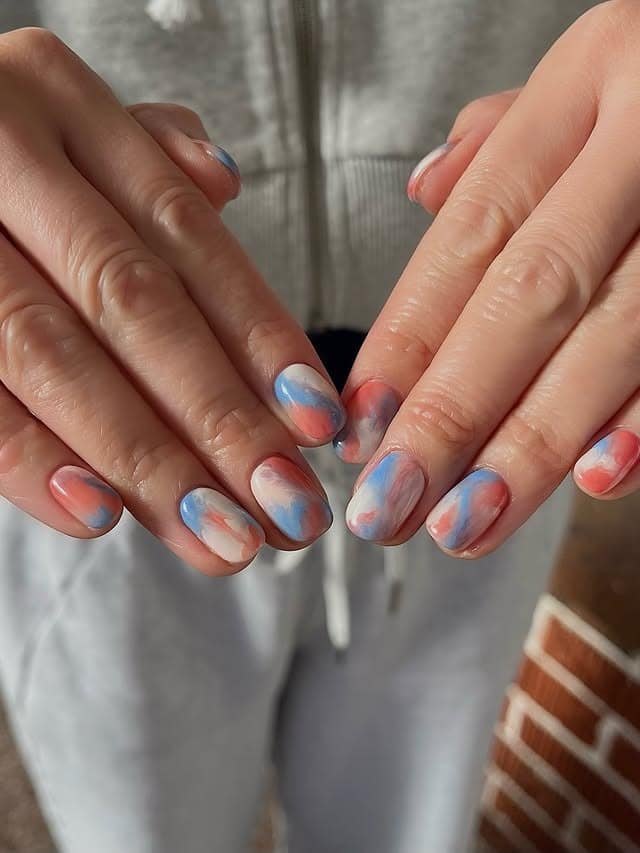 8. Pastel Marble Short Round Nails - marble nail ideas