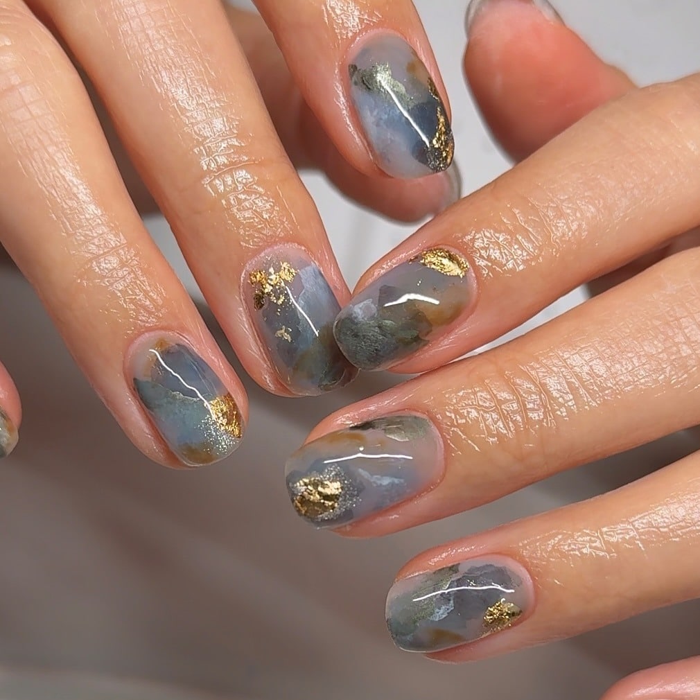 21. Smoky Gray Short Marble Nails with Gold Foil - marble nail ideas