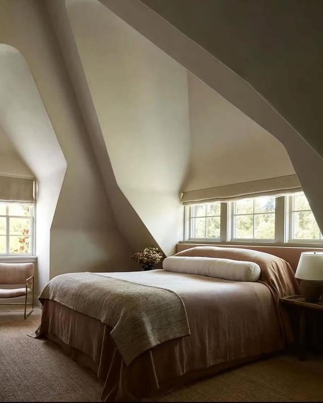4. Warm Beige Attic Bedroom Ideas with Curved Ceiling Details - attic bedroom ideas