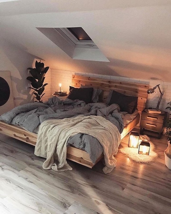9. Moody Rustic Attic Bedroom Ideas with Warm Ambient Lighting - attic bedroom ideas
