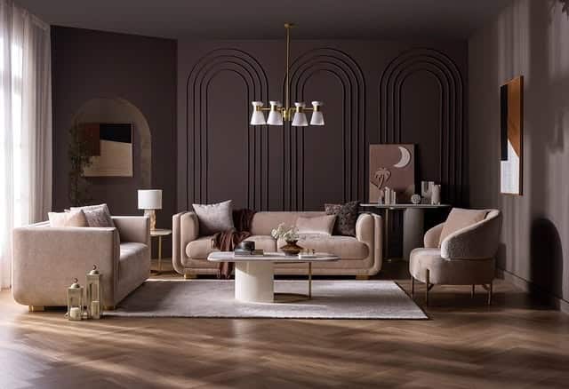 2. Mocha Earthy Living Room with Curved Wall Panels - earthy living room ideas