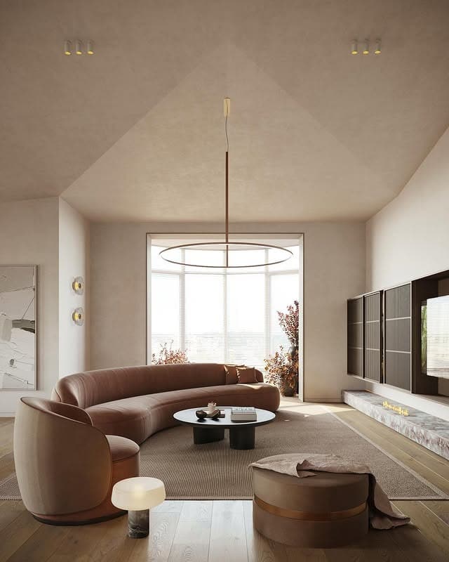 10. Contemporary Taupe Earthy Living Room with Curved Sofa - earthy living room ideas