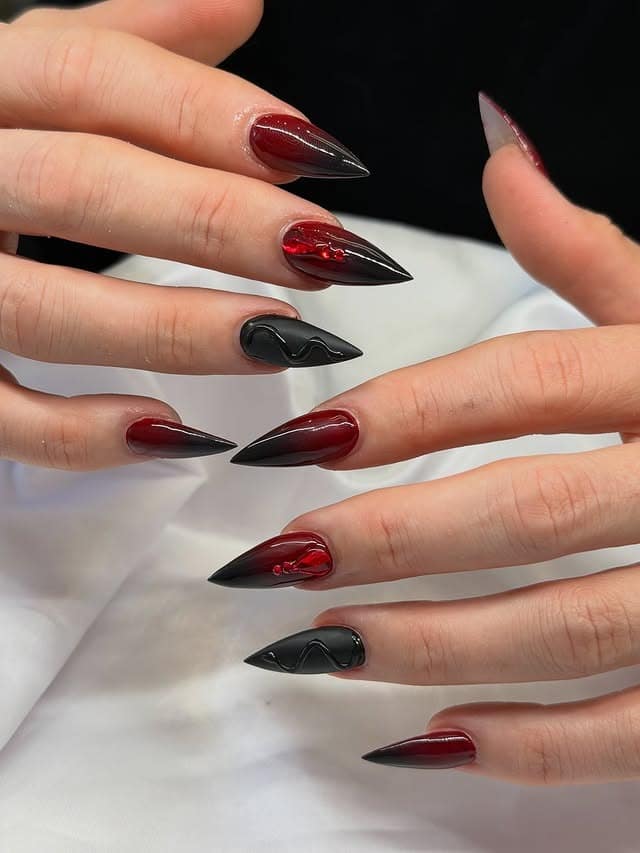 7. Black and Wine Chrome Almond Nails - red and black nail ideas