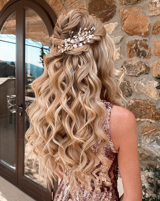 2. Romantic Half-Up Blonde Waves with Floral Clip - Bride Hairstyles