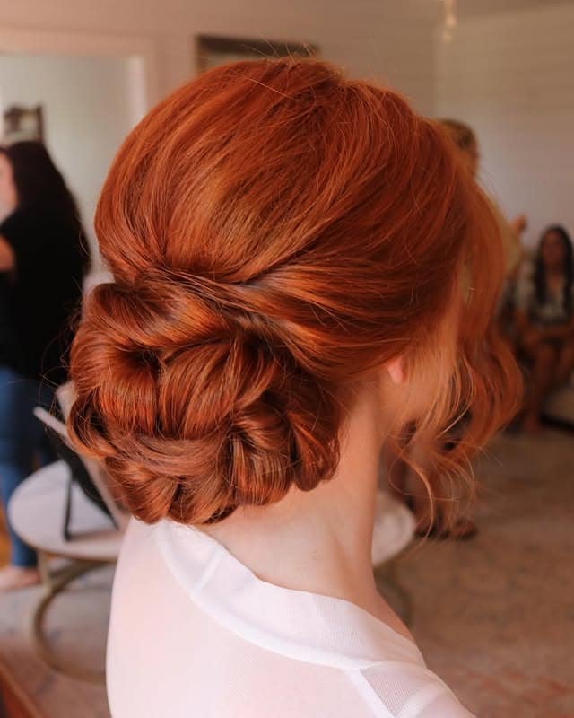 11. Classic Auburn Low Bridal Bun - Bride Hairstyles