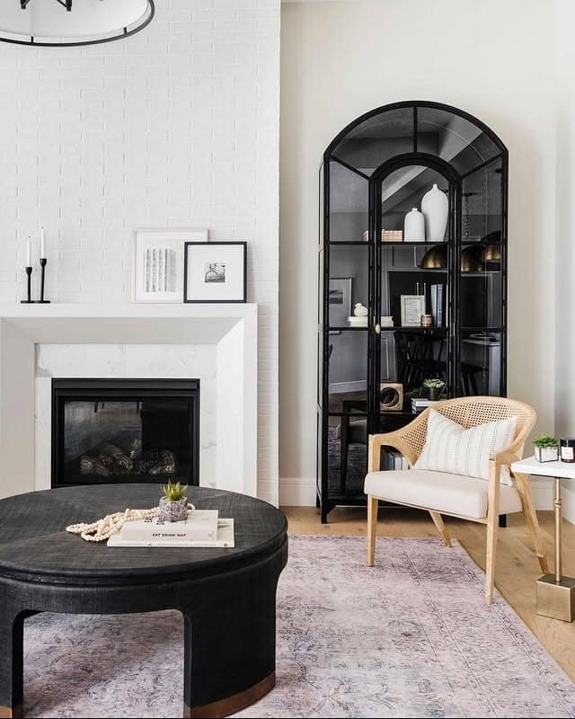 5. Black and White Living Room with Glass Display Cabinet - black and white living room ideas