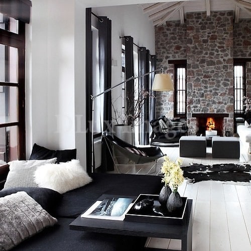 10. Rustic Black and White Living Room with Stone Fireplace - black and white living room ideas