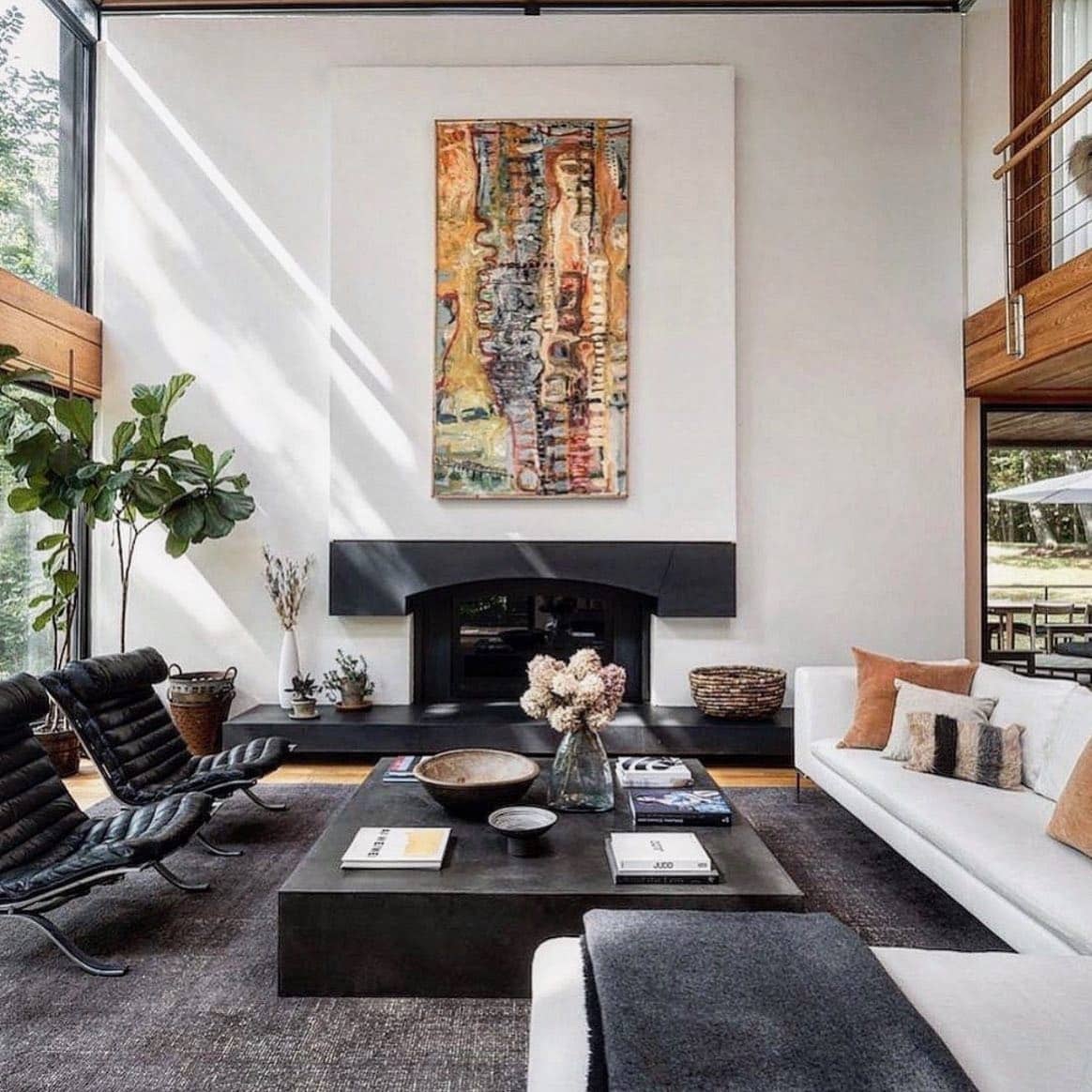 12. Modern Black and White Living Room with Statement Fireplace - black and white living room ideas