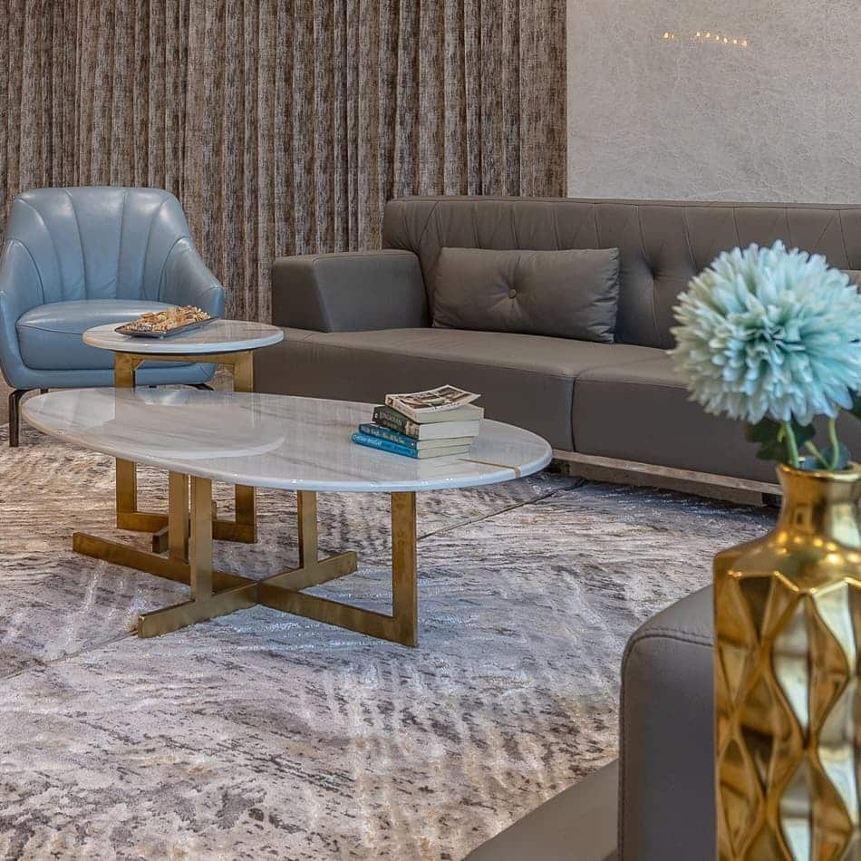 7. Contemporary Blue and Gray Living Room with Marble Tables - blue and gray living room ideas