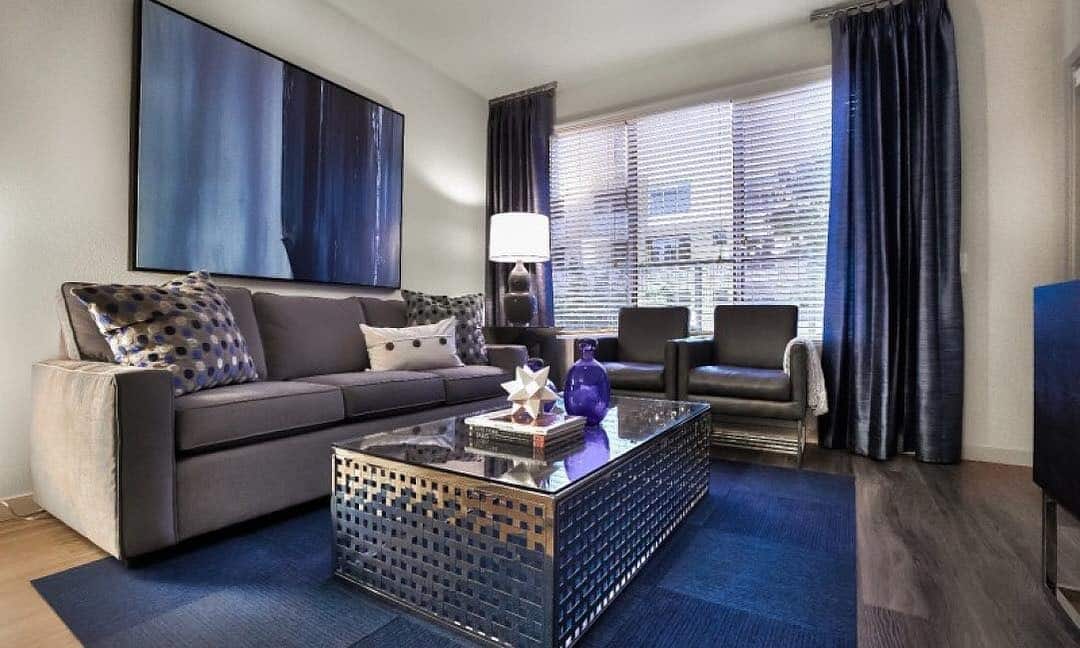 8. Moody Blue and Gray Living Room with Luxe Details - blue and gray living room ideas