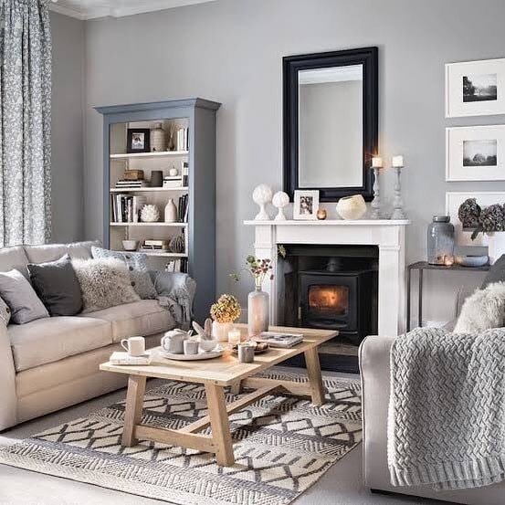 10. Light Blue and Gray Living Room with Cozy Fireplace - blue and gray living room ideas