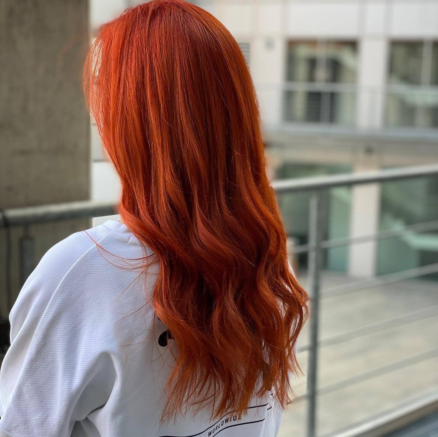 3. Sleek Copper Red Orange Layers - Red Orange Hair Color