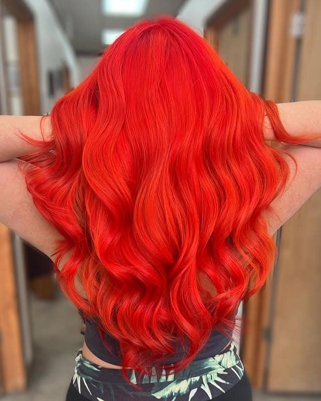 10. Bright Red Orange Hollywood Waves - Red Orange Hair Color