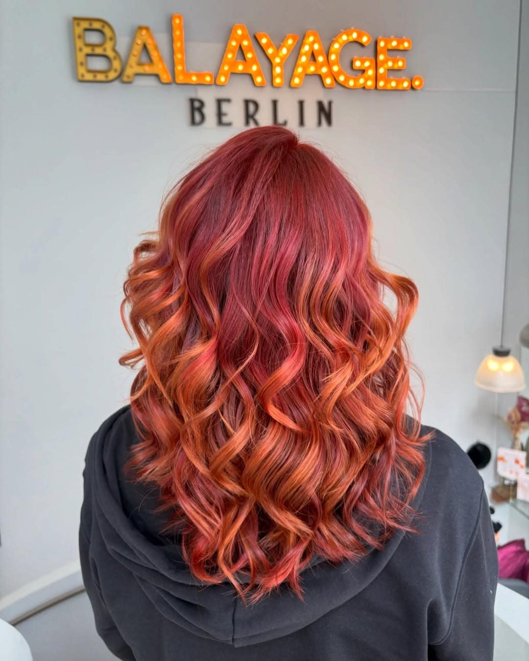21. Layered Red Orange Balayage Waves - Red Orange Hair Color