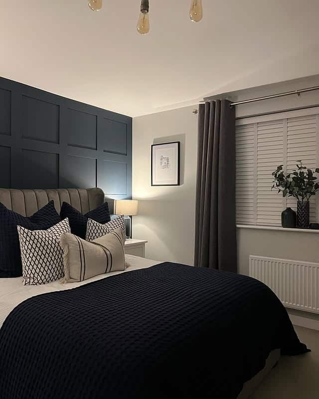 1. Navy Blue Board and Batten Bedroom with Soft Gray Accents - navy blue bedroom ideas