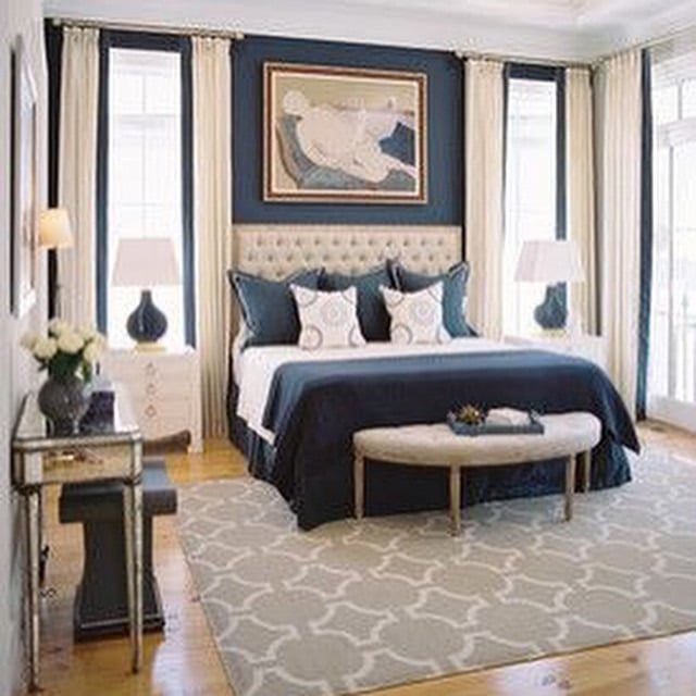 4. Classic Navy Blue Bedroom with Cream Drapes - navy blue bedroom ideas