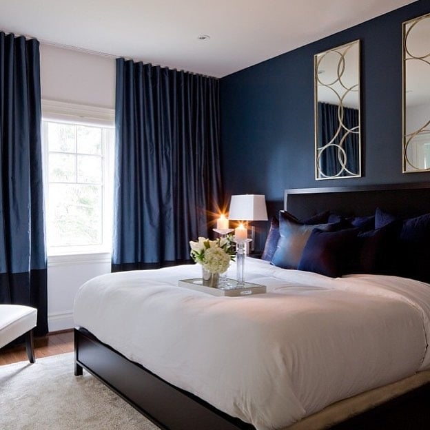 18. Navy Blue Bedroom with Black Furniture and White Bedding - navy blue bedroom ideas