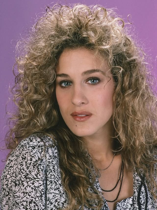 2. Voluminous Ash Blonde Spiral Curls - 80S Hairstyles
